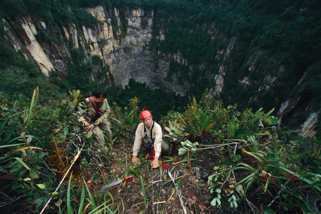 Charles Brewer preparing to repel into a sinkhole